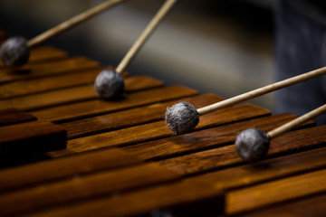  Drum sticks hitting the marimba closeup
