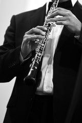 Fototapeta premium Human Hand playing the oboe in black and white 