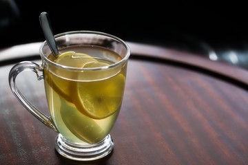 Tasty Hot Toddy With Lemon Slices In Glass Mug