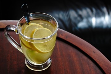 Tasty Hot Toddy With Lemon Slices In Glass Mug