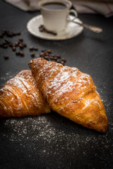 Croissant with sugar and coffee