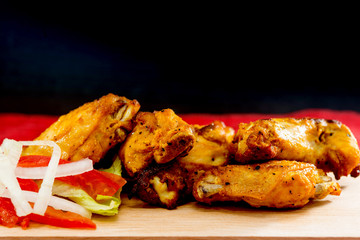 delicious fried chicken wings with salad