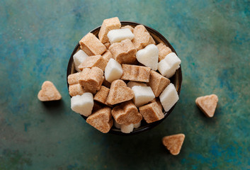 Brown cane sugar and a white sugar in a bowl