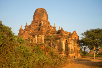 One of the pagodas of the ancient Buddhist temple Tha Kya Pone at dawn. Bagan, Burma