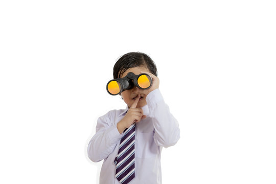 Little boy with binocular and gesture quiet