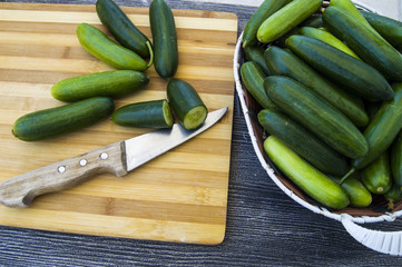 Fresh cucumber pictures on a white background, natural and organic cucumbers, cucumber pictures cut with a knife in a basket
