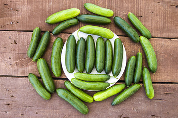 To make cucumbers, cut cucumbers with knife and make salad,Natural and organic tomatoes and cucumbers to consume and human health, natural vegetables
