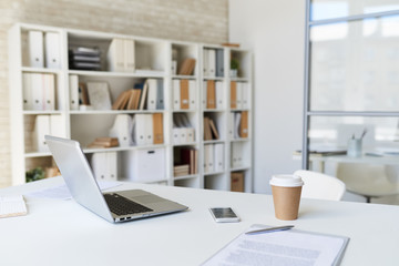 Laptop on Desk in Modern Office