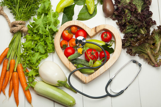 Fresh vegetables in the heart on a white background. Diet, a healthy lifestyle.