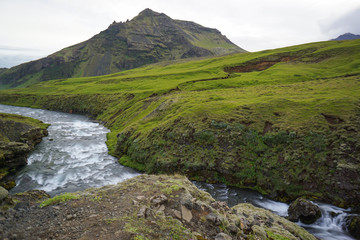Fototapeta na wymiar Mountain view of Skogarfoss waterfall, Iceland.
