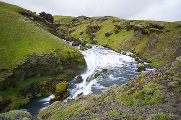 Mountain view of Skogarfoss waterfall, Iceland.