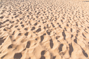 Footprints in the sand, footmarks, sand texture
