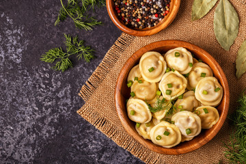 Homemade meat dumplings - russian pelmeni.