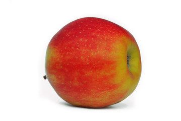 Red-yellow apple lies on its side on a white background