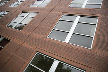 Artistic Angular View of Brick Building with Windows