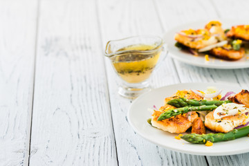Salad with fried halloumi, asparagus and orange zest. Copy space
