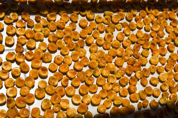 Dried apricots in the season, organic natural apricots cleaned from the seeds for drying, pictures of dried apricots in the sun, apricots arranged against the sun for drying,
