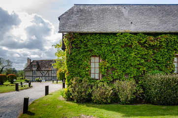 France timber house with a Ivy