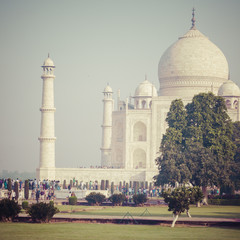 Amazing view on the Taj Mahal in sunset light with reflection in water. The Taj Mahal is an...