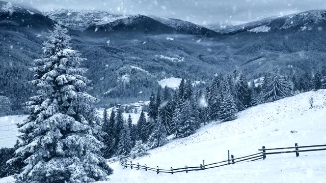 Winter background. Falling snow, trees and snowy mountains.