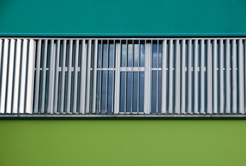 Close-up of colored building with central window