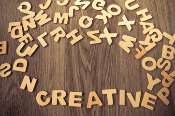 word creative made with wooden letters. Wooden illustration blackground - 167664072
