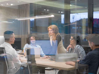 Startup Business Team At A Meeting at modern night office building