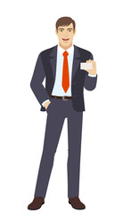 Fototapeta premium Businessman with hand in pocket showing the business card