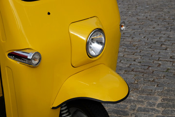 Close Up View of Tuk Tuk Against Cobble Street