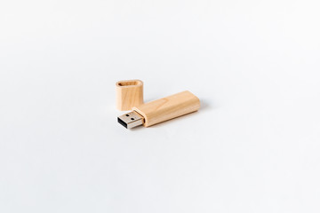 Light Wooden USB flash drive on a white isolated background. Copy space.