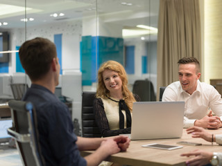 Startup Business Team At A Meeting at modern night office building
