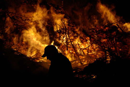 Silhouette of a man at Easter fire in the Netherlands