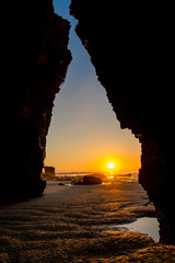 Scencis View of Rock Formation in Beach During Sunset