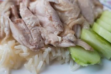 Fototapeta na wymiar Hainanese chicken rice , Thai gourmet rice topped with chicken ,thai food .