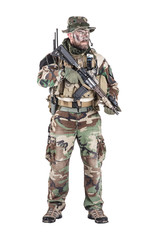 Special forces United States in Camouflage Uniforms studio shot. Holding weapons, wearing jungle hat, Shemagh scarf, painted face, his outfit clothes designed for jungle warfare. Studio shot isolated