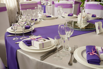 Restaurant banquet hall with served decorated wedding tables