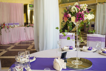 Restaurant banquet hall with served decorated wedding tables
