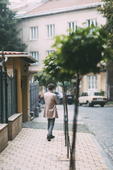 Fototapeta na wymiar Young man walking in the street
