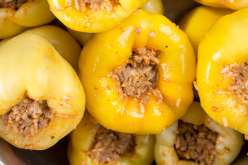 Closeup macro yellow paprika stuffed with minced meat and ready for cooking