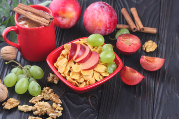 Healthy breakfast: muesli with milk, fresh fruit, nuts