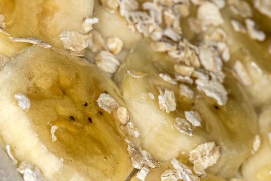 Banana slices with oats and honey close up