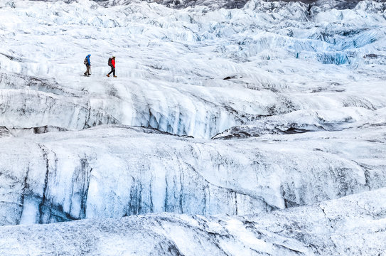 Two people trekking on ice Vatnajokull glacier