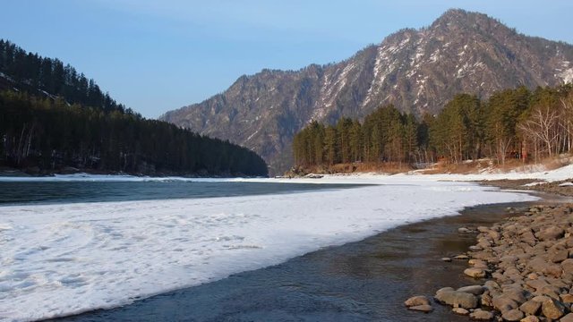 Altai river Katun with  ice and snow in winter season near Barangol settlement