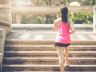 Woman fitness outdoor concept, young asian beautiful woman/sport girl running walking at outdoor park with fresh, relax, happy feeling.