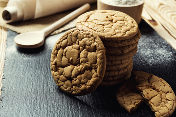 Biscuit sweet cookie background. Domestic stacked butter biscuit pattern concept,close up macro.Homemade cookies on wooden table.Cereal biscuits with the sesame,peanuts,sunflower and amaranth.