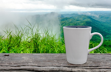 Obraz premium cup of coffee on abstract nature background