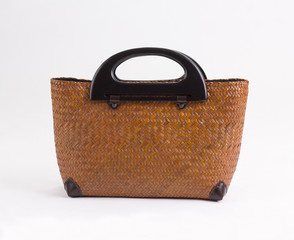 Brown wicker handbag with wooden handles