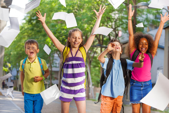 Cool Kids Throw Papers In The Air From Excitement