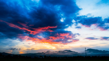 Red and black cloudy move to mountain befor storm and rain.