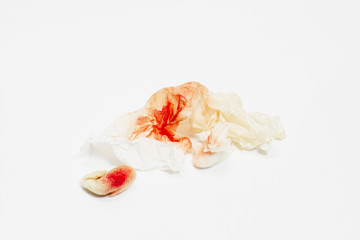 Blood on tissue and cotton on white isolate background  with copy space and  clipping path, the pain of the teeth and body